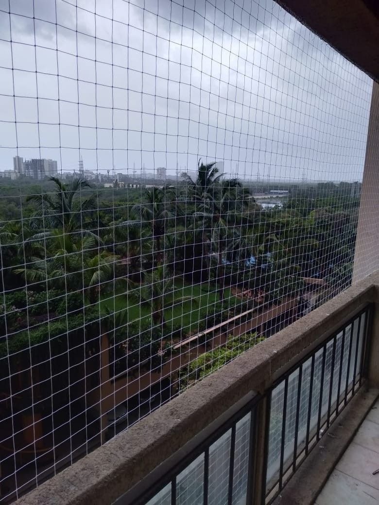 Protective mesh across an apartment balcony