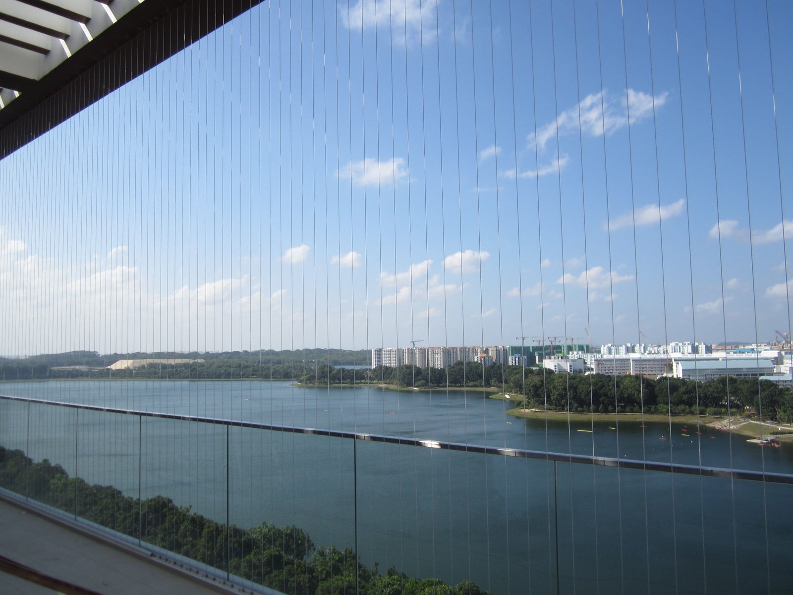 Near-invisible balcony safety wires with an open city view