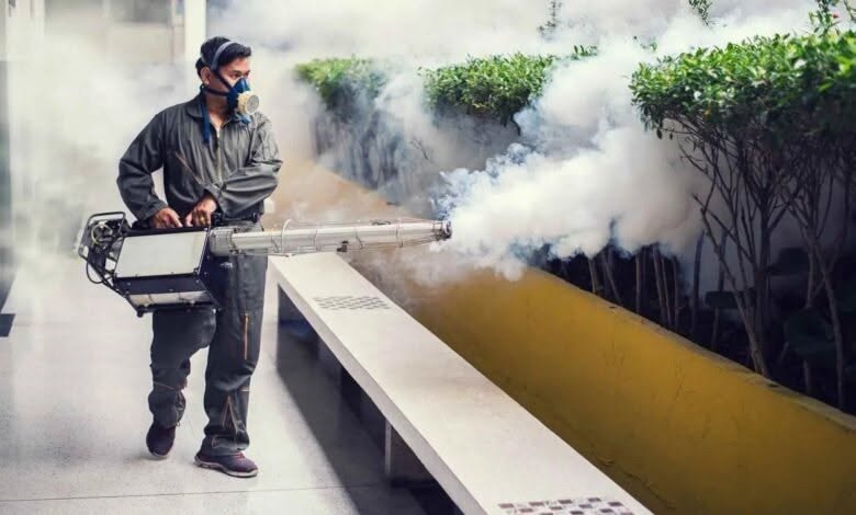 Outdoor pest fogging carried out by a technician